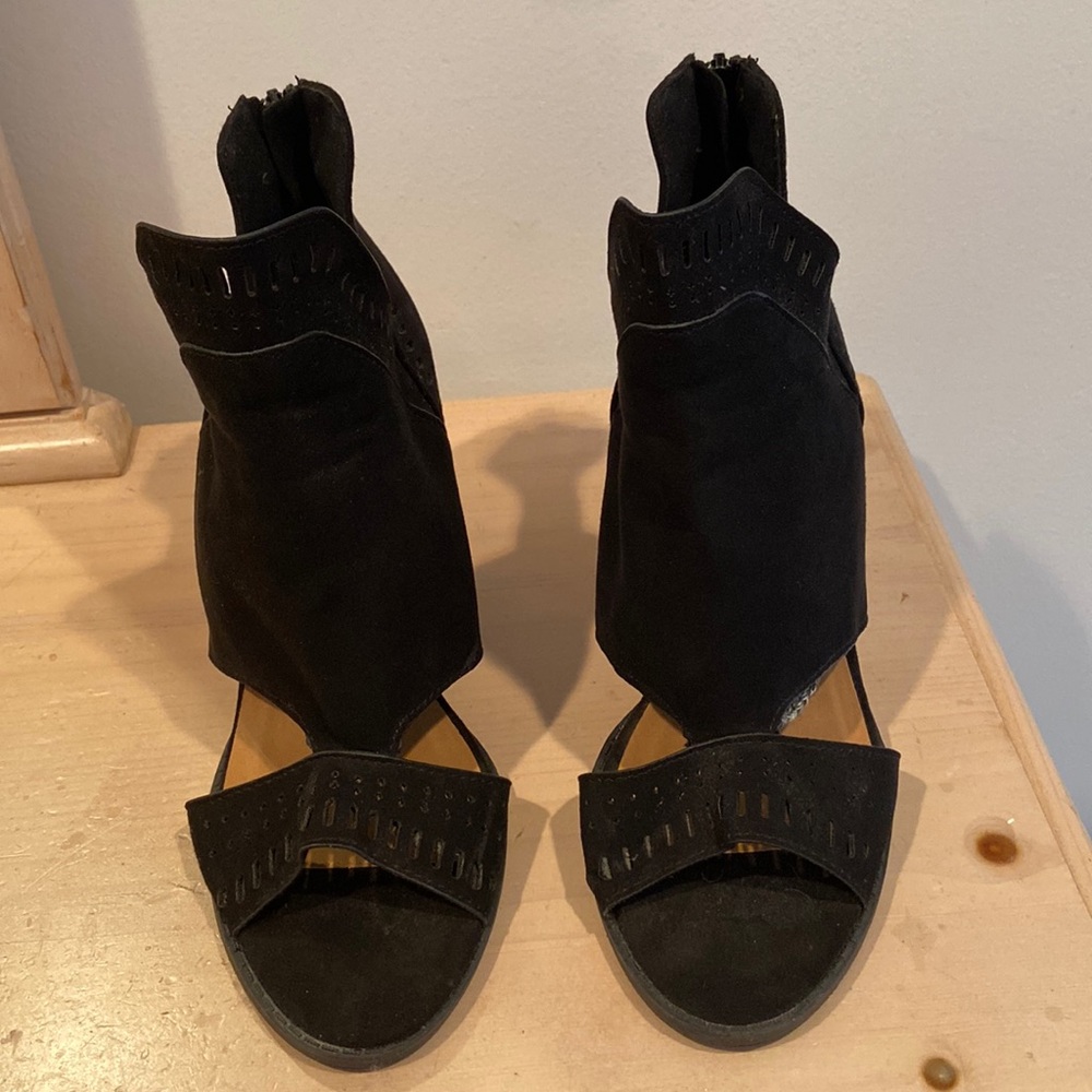 Black suede open toed heels.